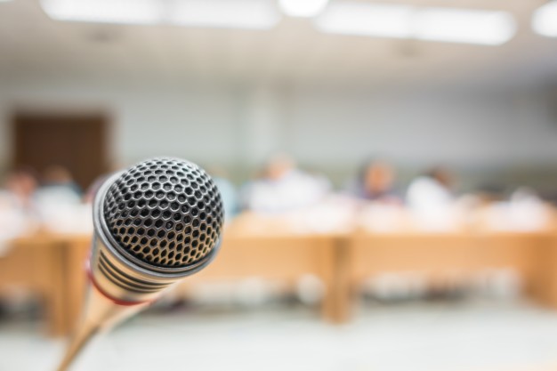 black-microphone-in-conference-room-filtered-image-processed-v_1232-2777